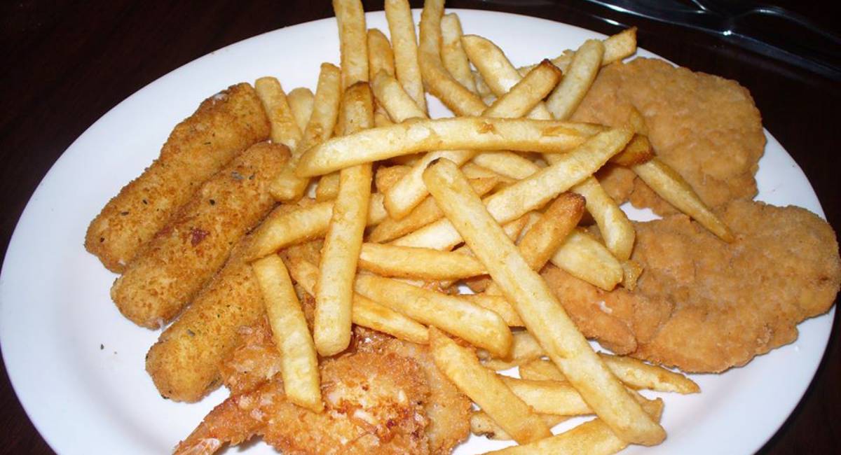 plate of fries, mozz sticks, and fried shrimp