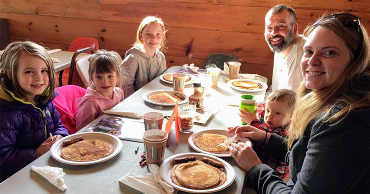 a family pancake breakfast in a restaurant