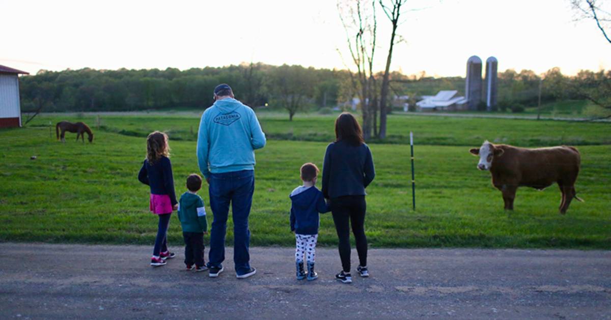 family looking at a farm