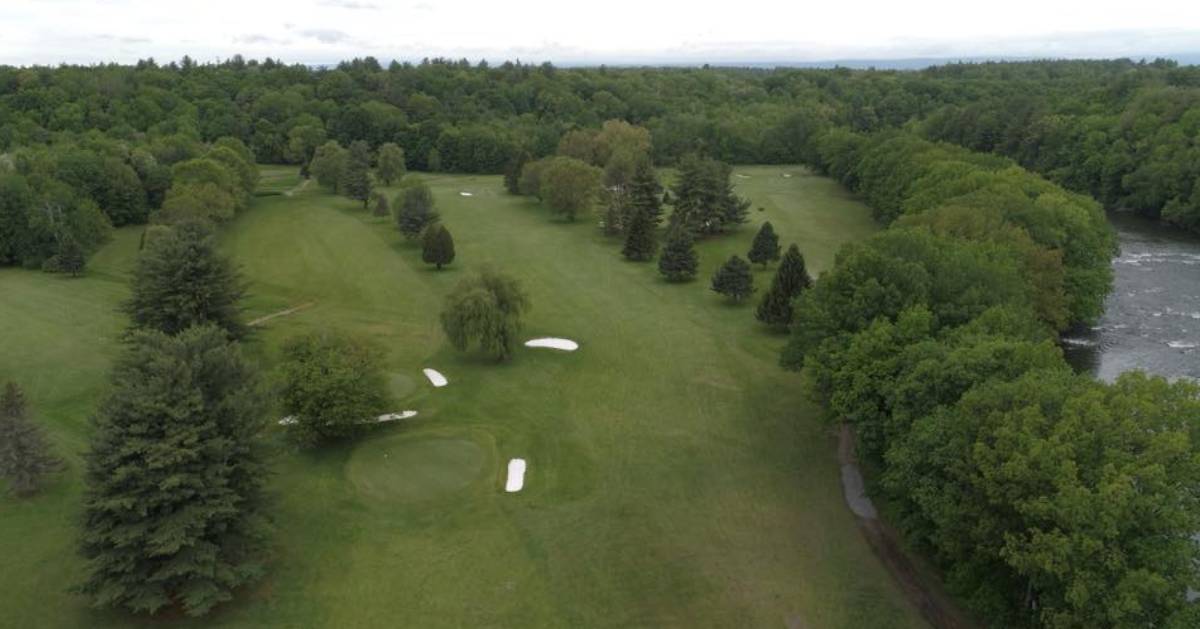 overhead view of a golf course and trees