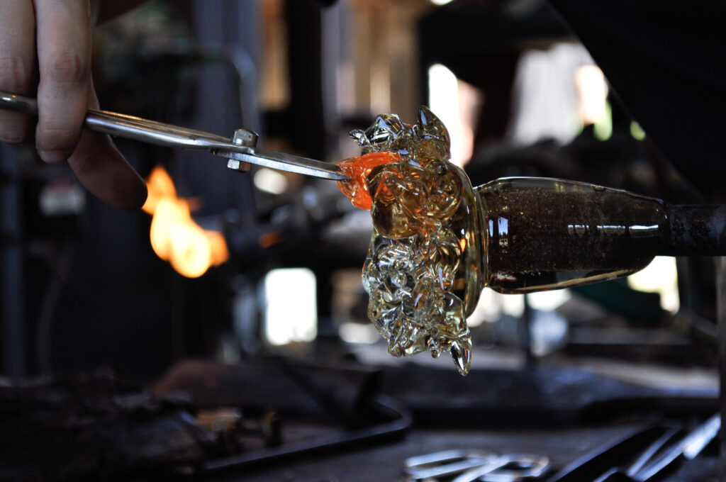 A glassblower creates a piece of Upstate New York Art