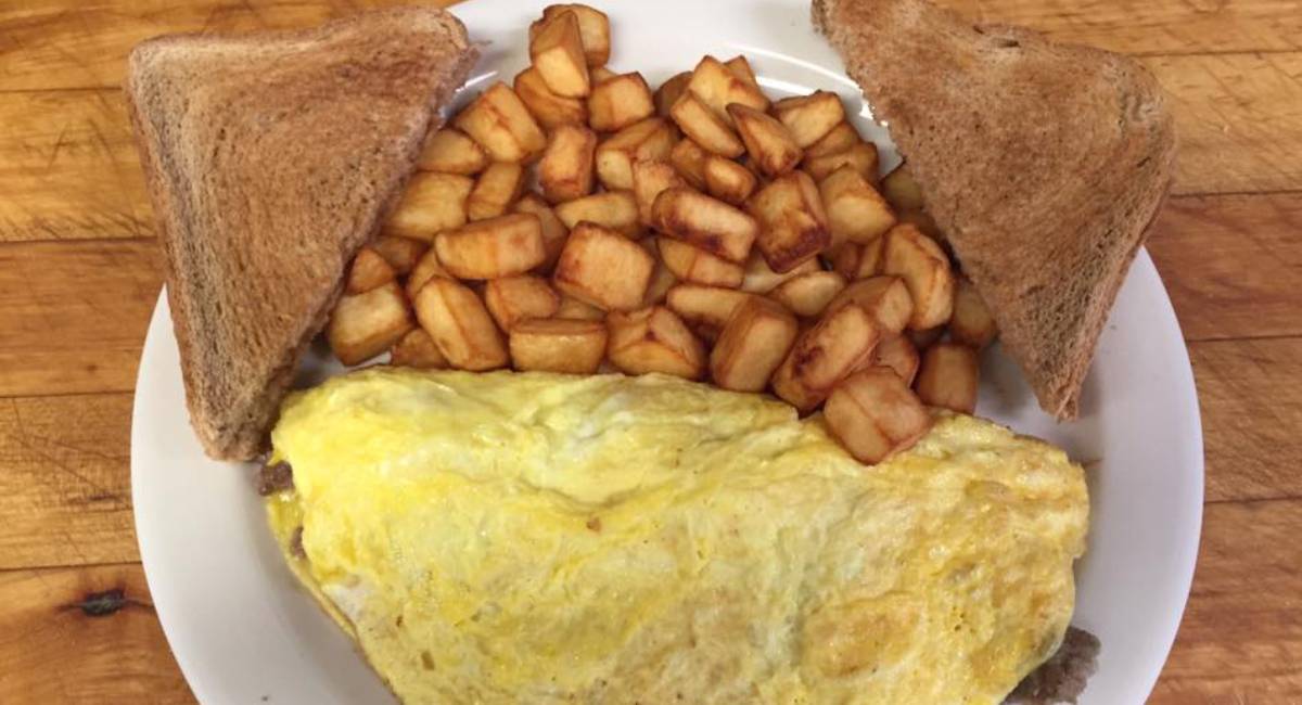an omelet and home fries and toast on a plate