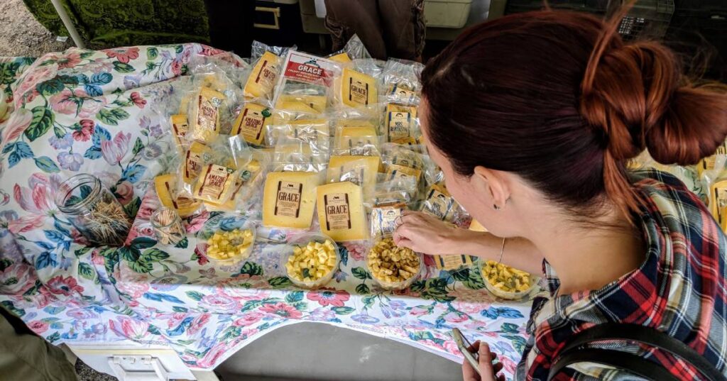 woman near cheese samples