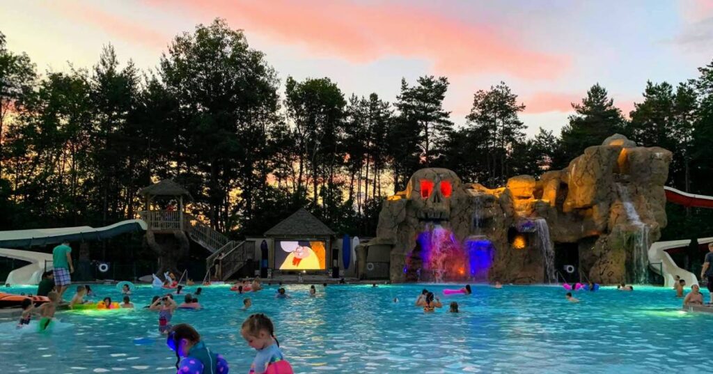 The pool at Moose Hill Lock which has a mountain shaped like a skull with water coming out of its mouth. There is also a large screen showing some cartoons.