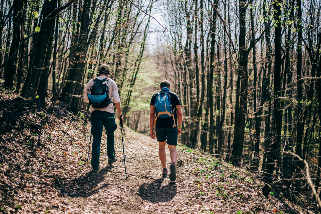 Two men hiking through a trail