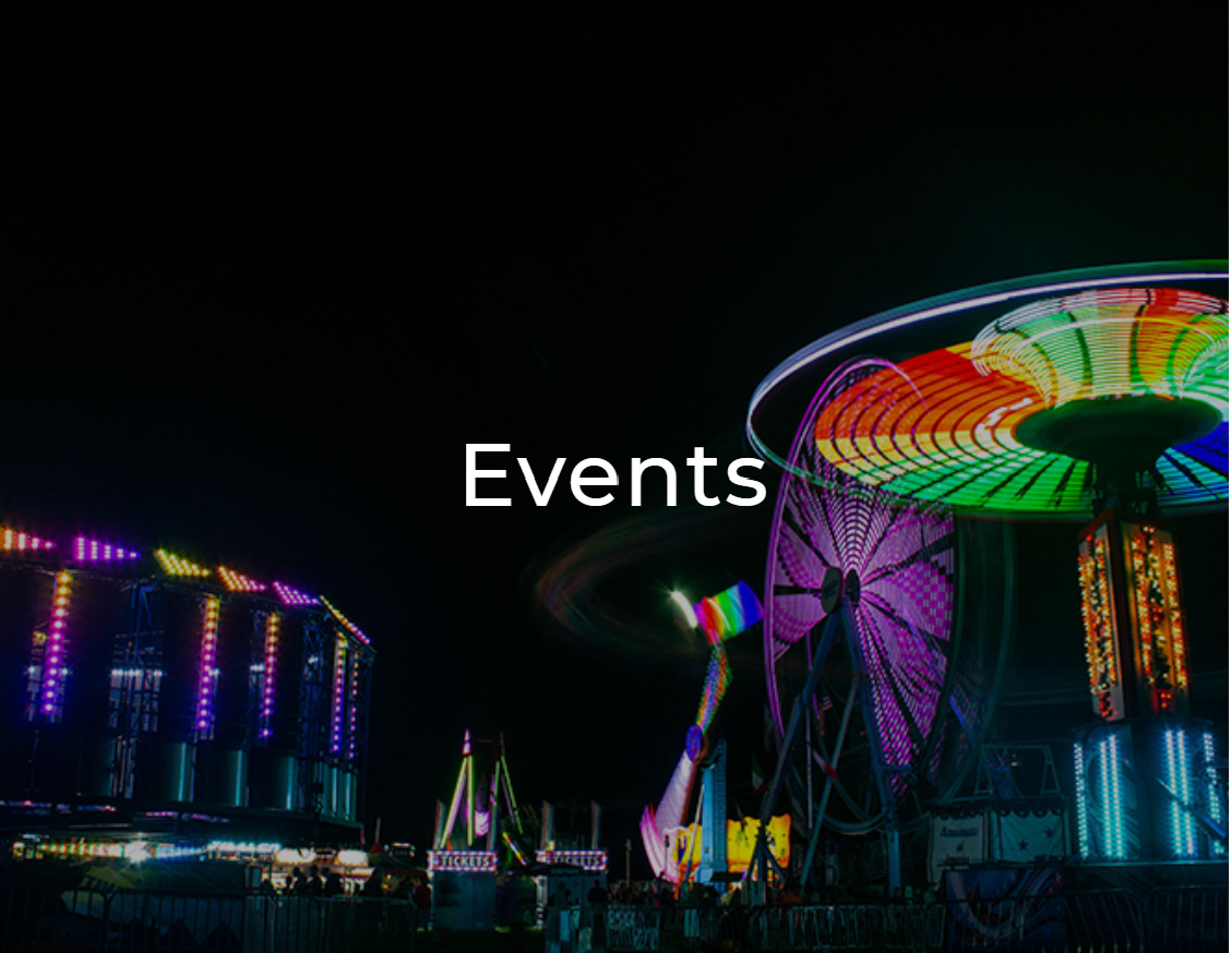 Carnival rides well lit in colorful lights at night with the word Events overlaid on it