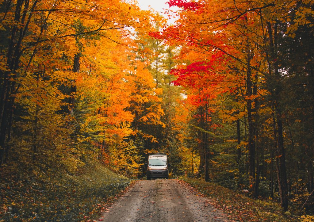 RV traveling through fall foliage, headed to one of the RV parks Washington County NY